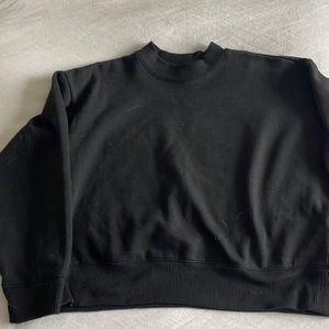 Black crewneck sweater